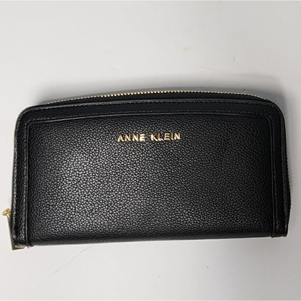 ANNE KLEIN Logo Slim Fold Zip Around Wallet in Black.